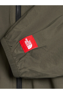 Olive green nylon sleeve with red the north face tag on the men’s packable nylon jacket beige product