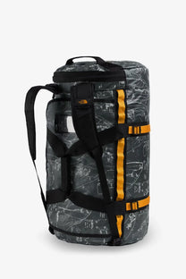 The north face men recycled pvc base camp duffel backpack in black and orange with a gray map pattern