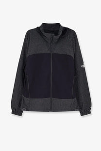 The north face men’s relaxed fit jacket black features a grid pattern upper and lower with solid black midsection and sleeve logo