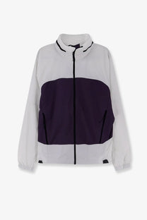 The North Face men’s relaxed fit windbreaker jacket white with navy purple midsection and black zipper accents