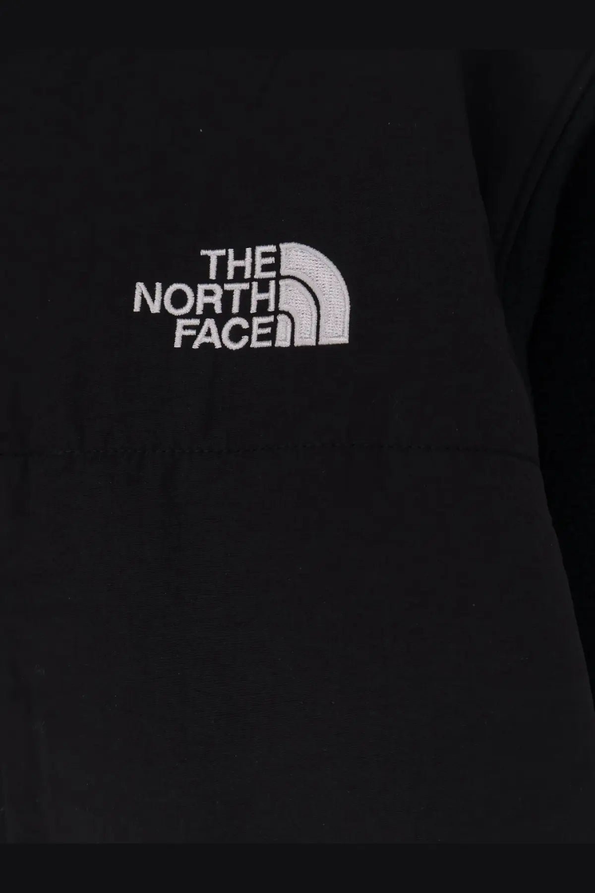 The north face men’s retro denali jacket in black with white embroidered logo features durable fleece material