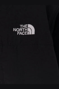 The north face men’s retro denali jacket in black with white embroidered logo features durable fleece material