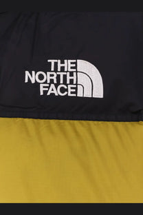 The north face men’s retro nuptse bicolor down jacket black with yellow panels and white embroidered logo