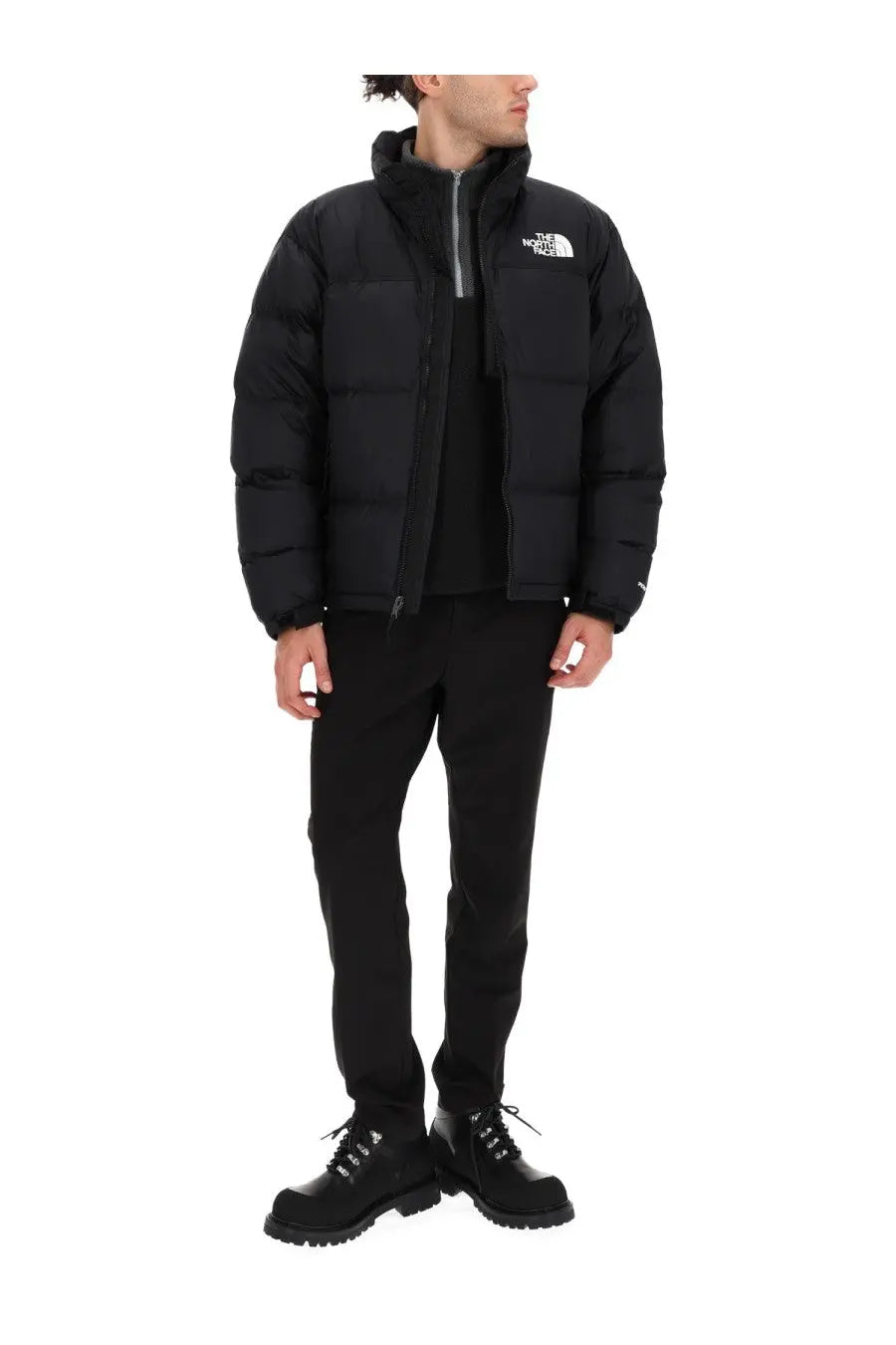 The north face men’s retro nuptse jacket black puffer jacket with quilted design and white logo on the chest