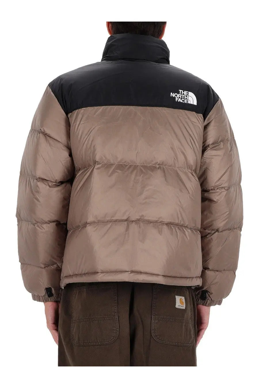 The north face men’s retro nuptse jacket brown shown from the back with tan puffer body and black collar and shoulder panels