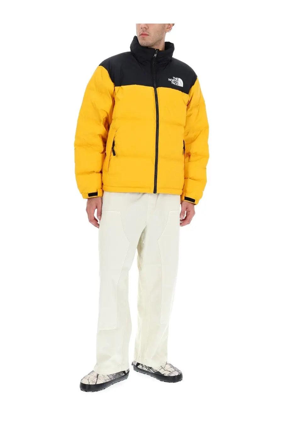 The North Face men’s Retro Nuptse yellow and black quilted puffer jacket with logo on the chest