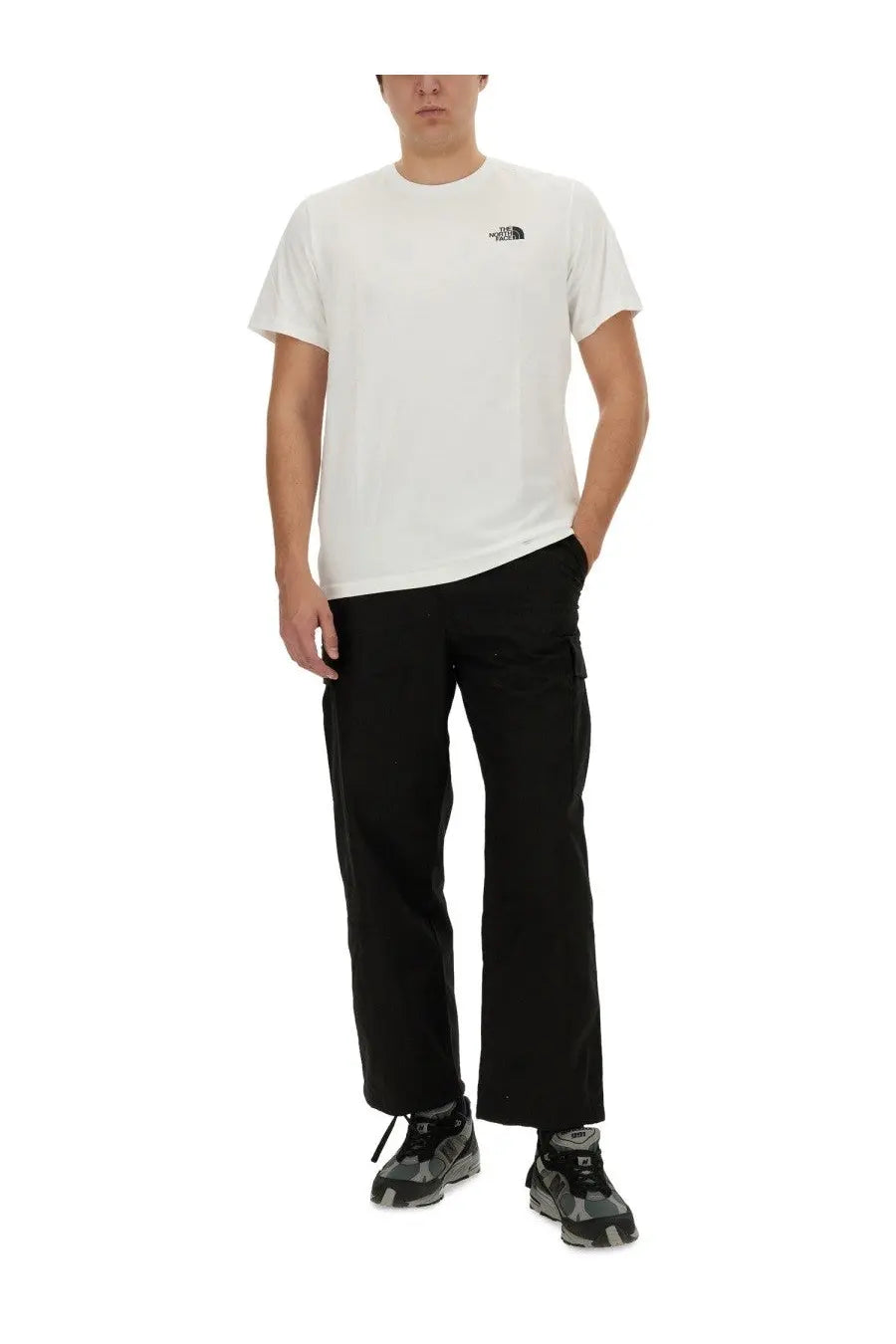 The north face men’s white t-shirt features a small black logo on the chest in a comfortable cotton fabric