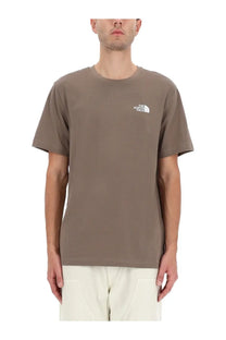 The north face men’s simple dome shirt brown is a muted olive green short-sleeved t-shirt with a small white logo on the chest