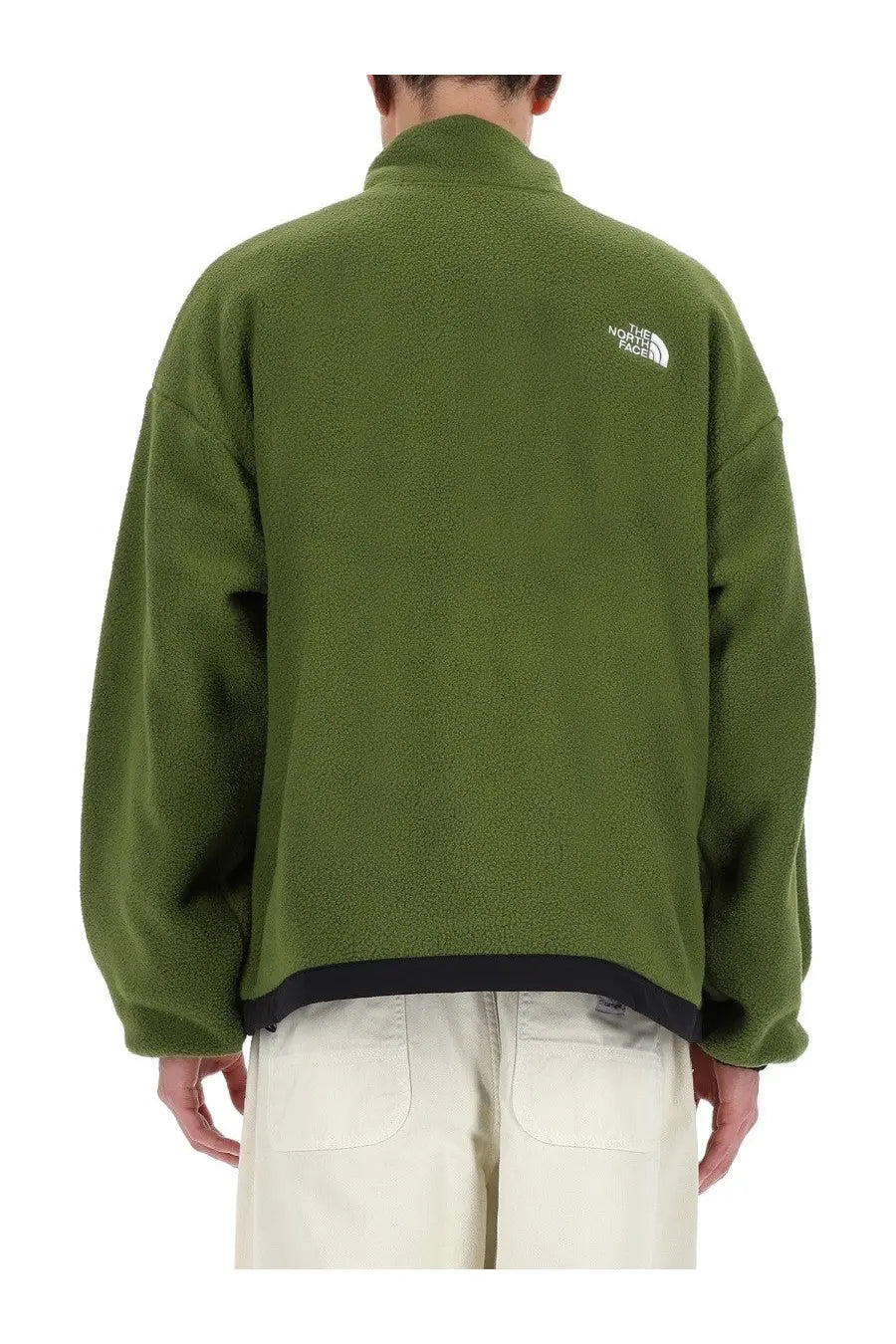 The back of an olive green fleece jacket with black trim and a white the north face logo on the back