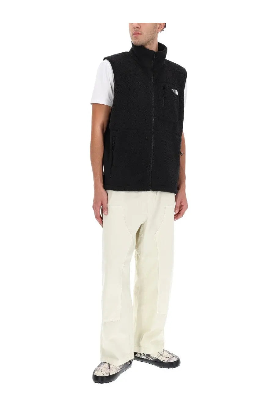 The North Face men’s Yumiori vest is a black fleece vest with a high collar and front zipper for warmth and comfort