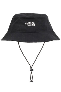 The north face unisex bucket hat norm black in black features a white embroidered logo and adjustable chin strap