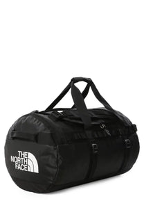 Black the north face unisex duffel bag with white logo and reinforced straps for durable base camp use