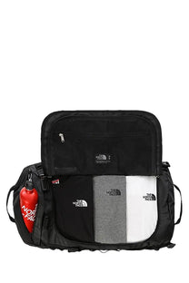 The north face unisex duffel bag black with side pocket and red water bottle ideal for base camp use
