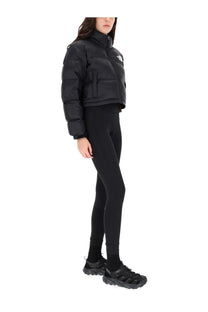 The North Face women’s Nuptse black puffer jacket with quilted design and small white logo on the chest