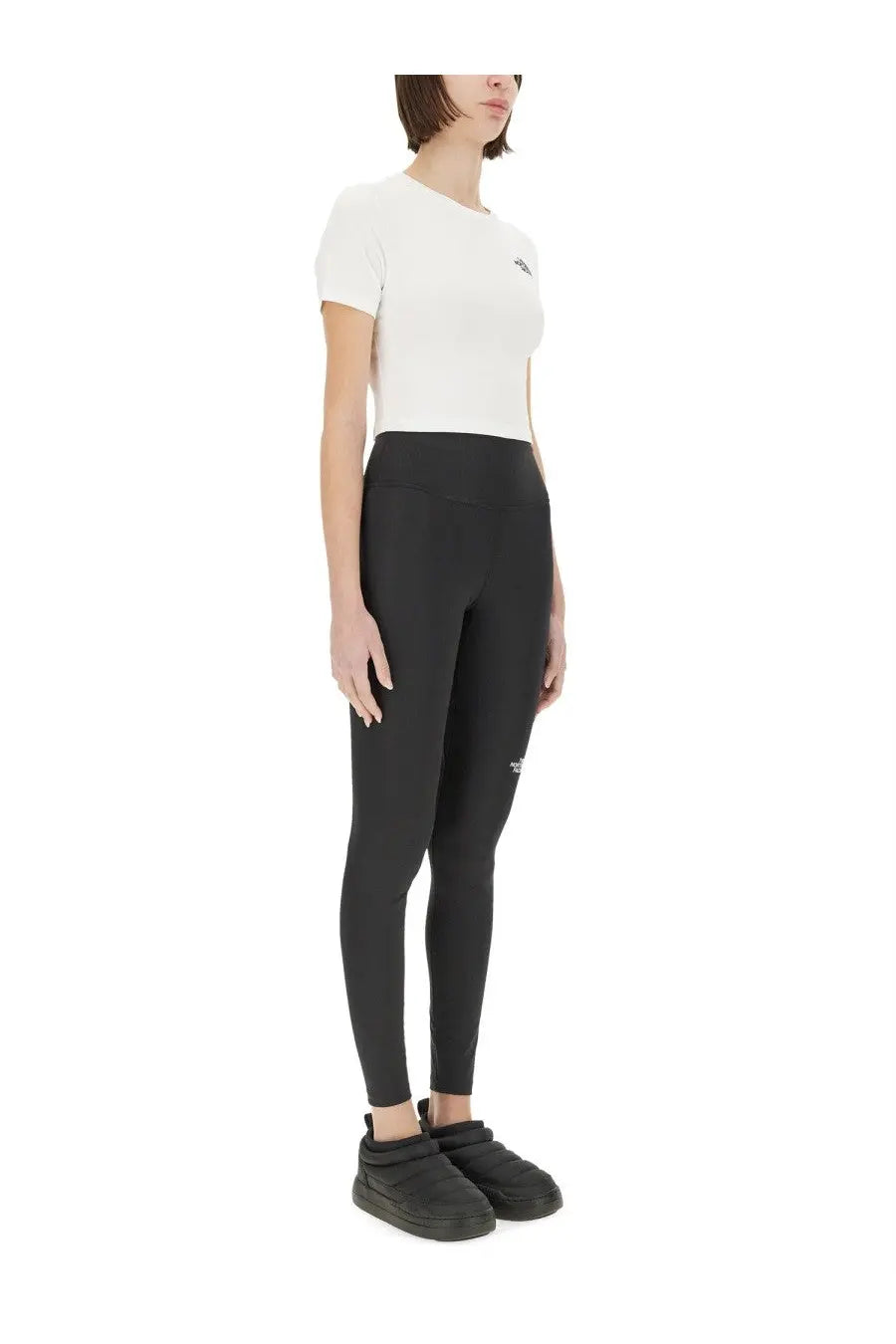 The North Face women’s black high-waisted leggings with a subtle logo on thigh and waistband made for active wear