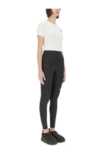 The North Face women’s black high-waisted leggings with a subtle logo on thigh and waistband made for active wear