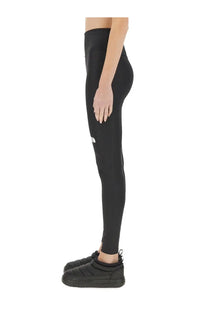 The north face women’s black high-waisted leggings with a small white logo on the thigh for active wear