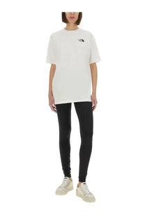 White the north face women’s simple dome oversized shirt with small black logo on chest in cotton material