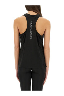 The North Face women’s black tank top with racerback design and vertical white logo on the back side