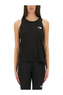 The north face women’s black sleeveless tank top features a white logo on the chest made from lightweight material