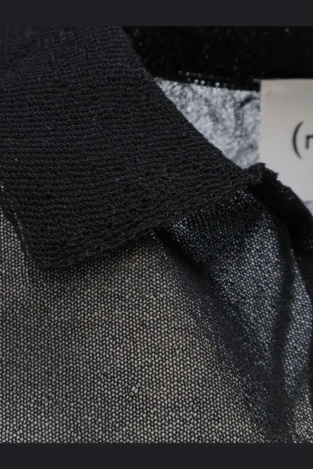 Nude women’s black cotton blend polo shirt with solid collar and sheer textured mesh body