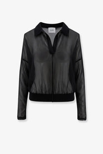 Black sheer bomber jacket with solid black collar and cuffs styled over nude women’s cotton blend polo shirt black