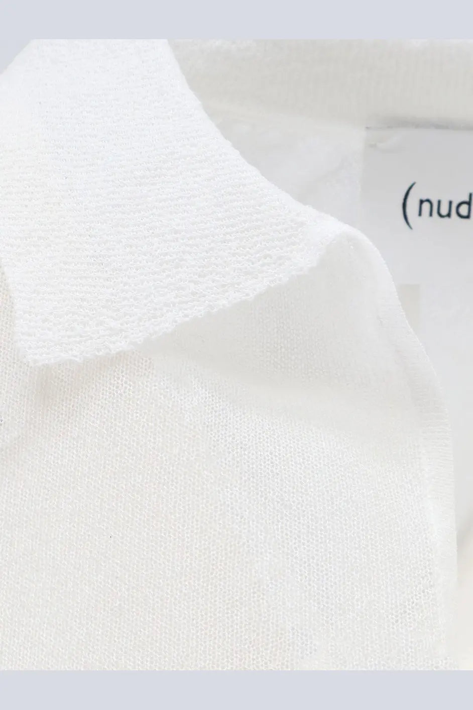 White knit polo shirt collar with soft textured cotton blend fabric and subtle ribbed detailing for women