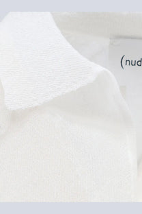 White knit polo shirt collar with soft textured fabric and subtle ribbed detailing in nude womens cotton blend polo shirt