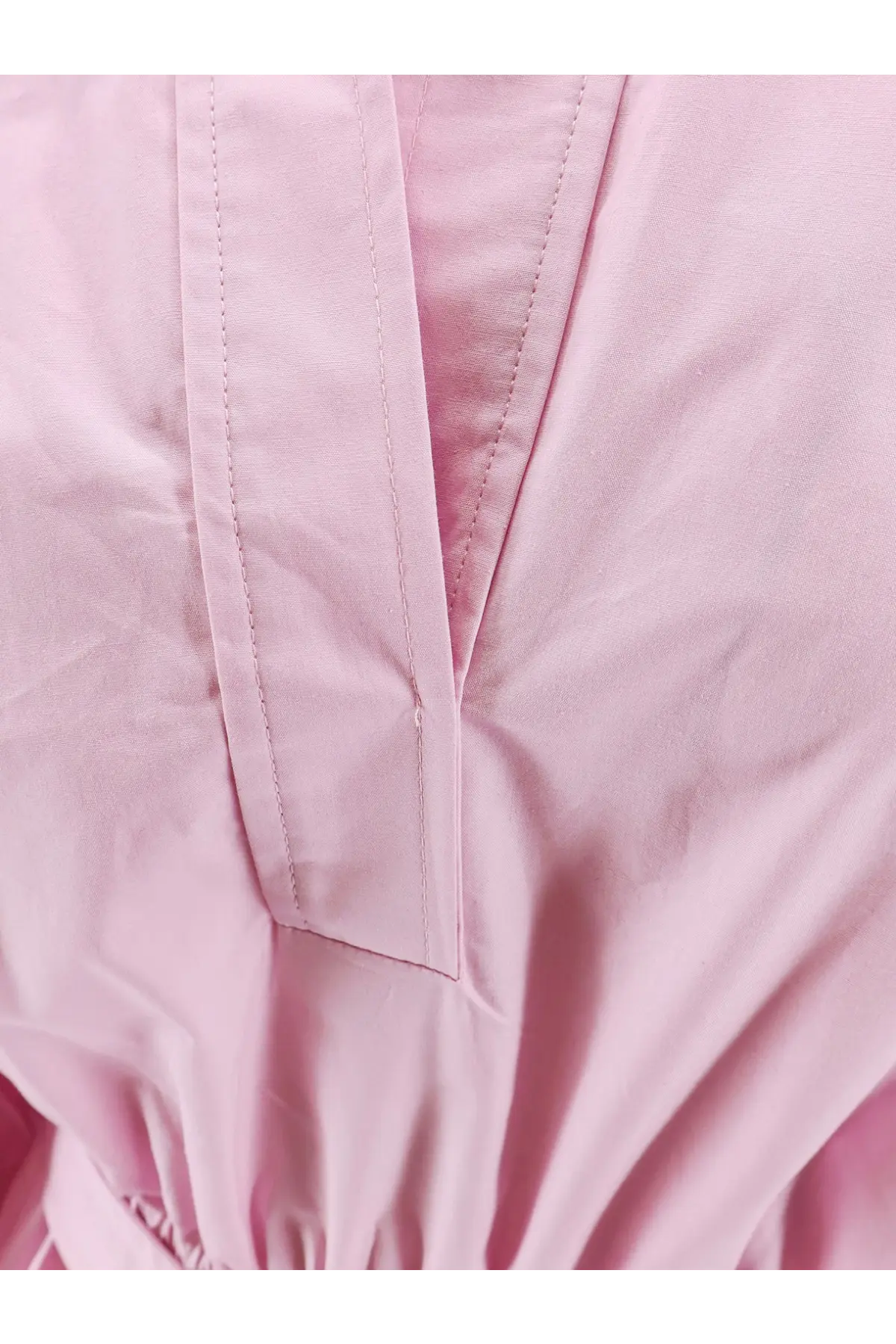 Nude women’s cotton polo dress in soft pink with subtle v-neckline and clean stitching details