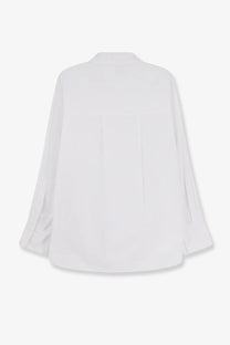 White oversized cotton button-down blouse with relaxed fit and long sleeves for women nude collection