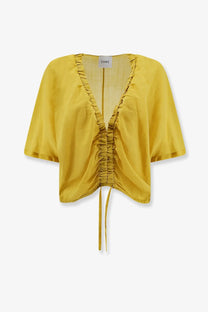 A mustard-yellow cropped linen blend top with ruched front and drawstring waist for Nude Women’s Cedar
