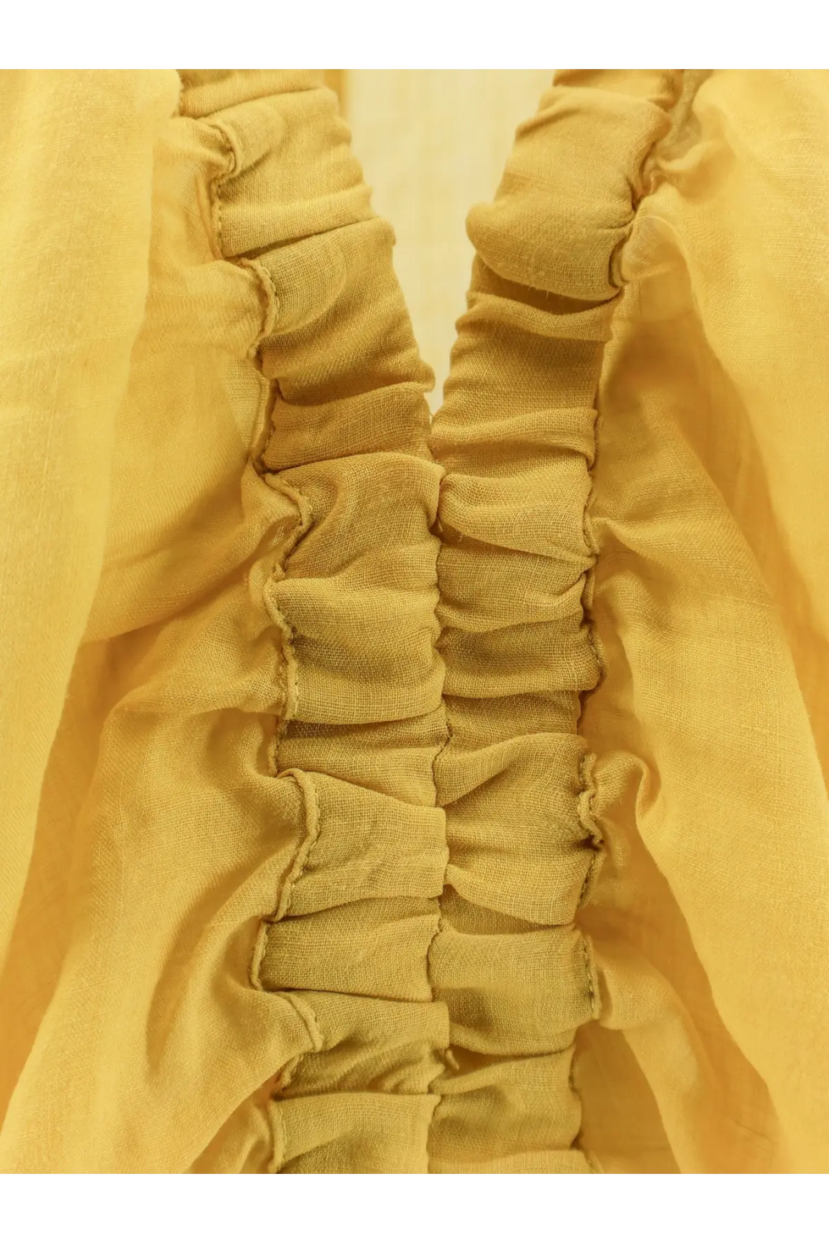 Nude women’s linen blend shirt cedar with mustard-yellow ruched fabric detail and vertical gathered pleats center back