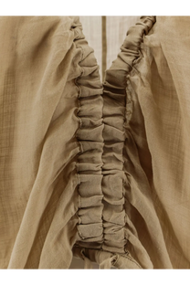 Nude women’s linen blend shirt in beige with gathered ruching along the side seam