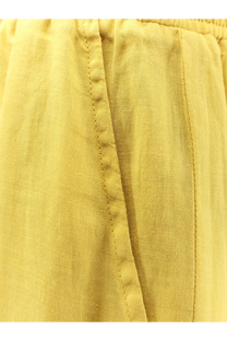 Nude women’s linen blend trousers cedar in yellow with relaxed fit slightly wrinkled texture and visible seam stitching