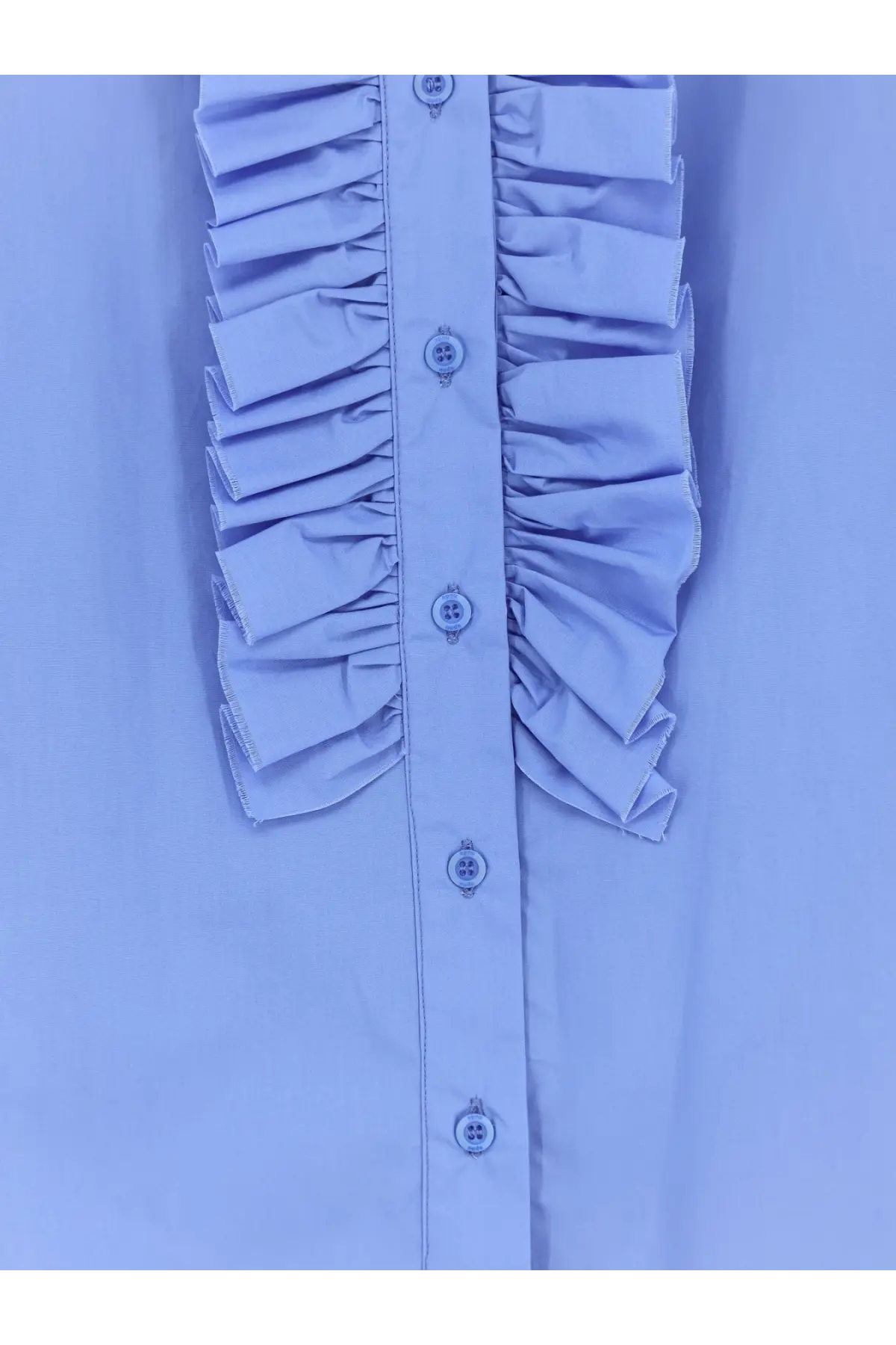 Light blue cotton ruffled blouse with decorative buttons down the front in a nude women’s oversize style
