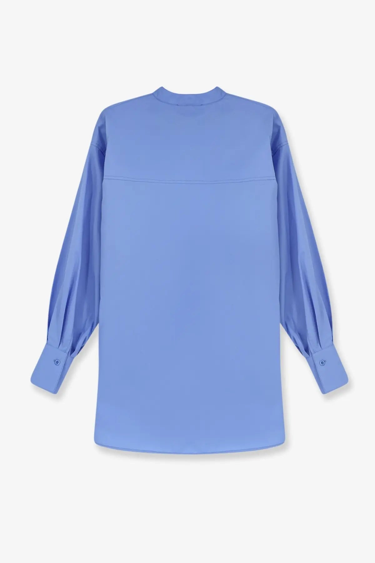 Nude women’s oversize cotton shirt in soft light blue with long sleeves and subtle chest seam