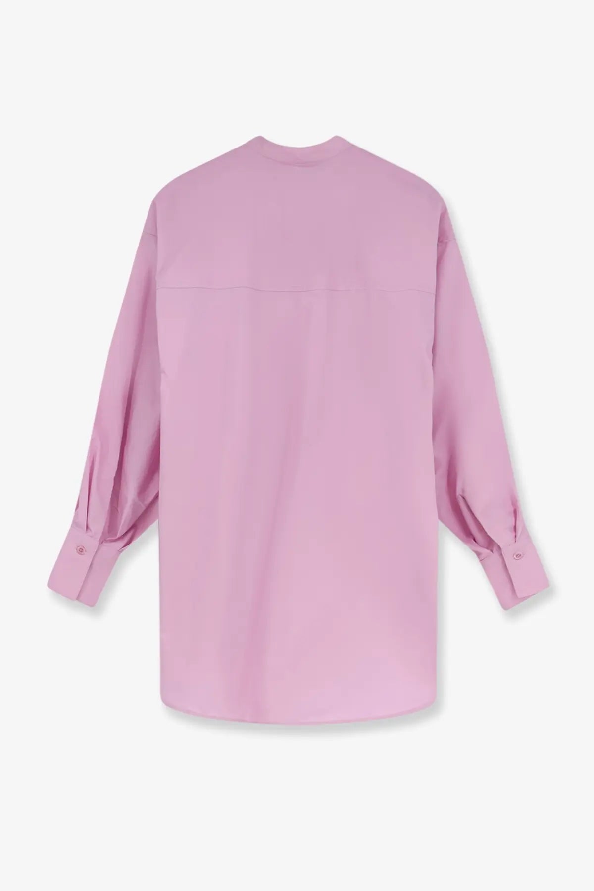 A soft pink oversized cotton button-up shirt for women with long sleeves and a relaxed fit