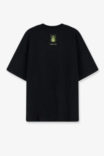 Oamc Peacemaker men’s black oversized cotton t-shirt showing back with small neon green beetle graphic