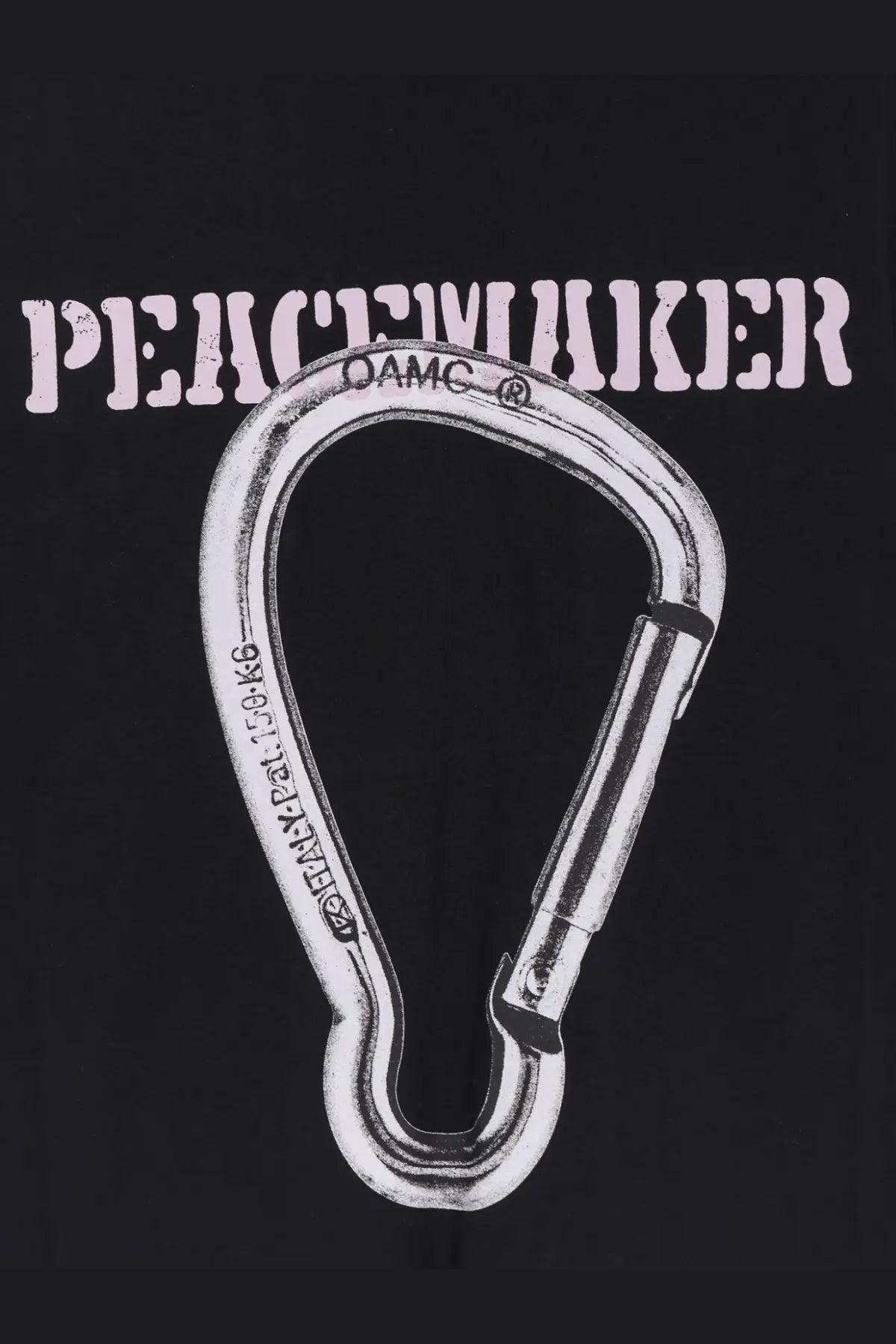 Silver metal carabiner with damc branding and weight rating engraved shown with oamc peacemaker men’s black cotton shirt