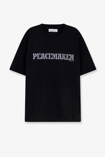 Oamc peacemaker men’s black cotton t-shirt with peacemaker printed in bold distressed white font across the chest