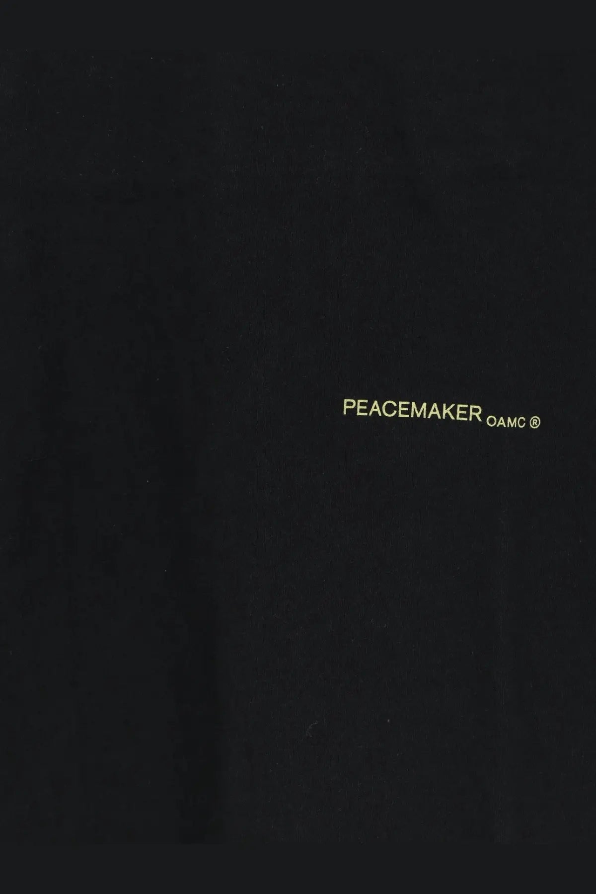 Black peacemaker oamc branded notebook cover with subtle gold lettering in mens cotton sirt black product