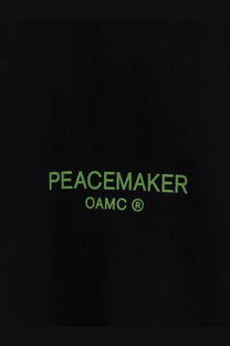 Black oamc peacemaker men’s cotton sweatshirt with neon green peacemaker and oamc text on black fabric