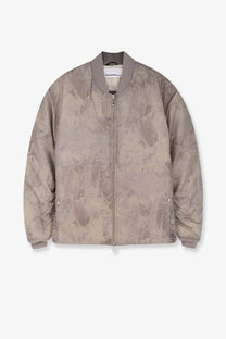 Oamc Peacemaker men’s taupe bomber jacket with subtle abstract pattern ribbed cuffs and placemaker label on collar