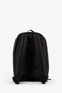 Black nylon oamc peacemaker men’s backpack with padded shoulder straps and top carry handle shown from back side