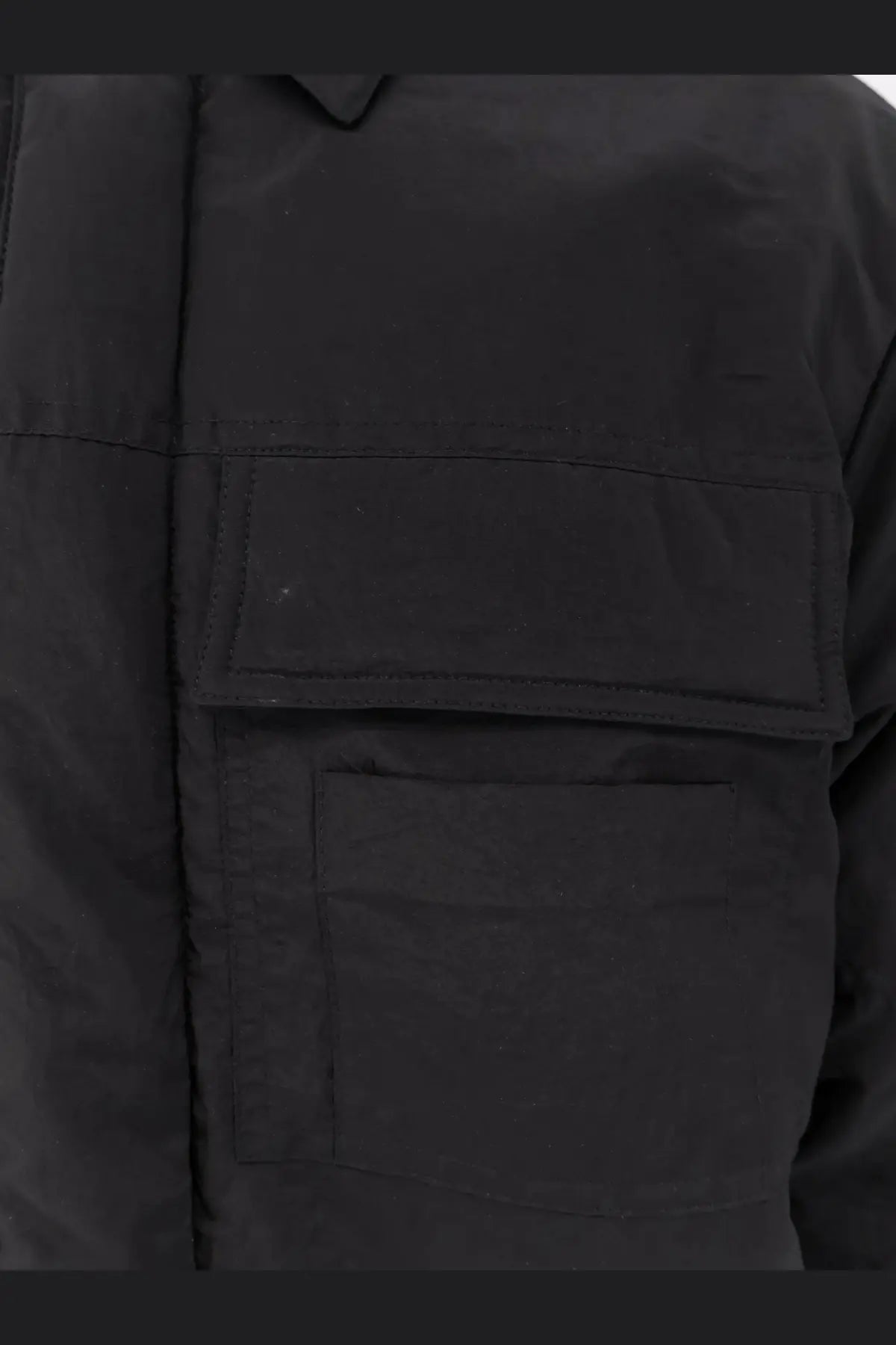 Oamc Peacemaker men’s black nylon jacket with two front flap pockets and structured minimalist utility design