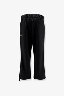 Oamc Peacemaker men’s regs black wool blend trousers with elastic waistband and white logo on left thigh
