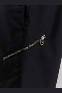 Black nylon jacket with silver zipper and pull tab shown with oamc peacemaker men’s regs wool blend trousers black