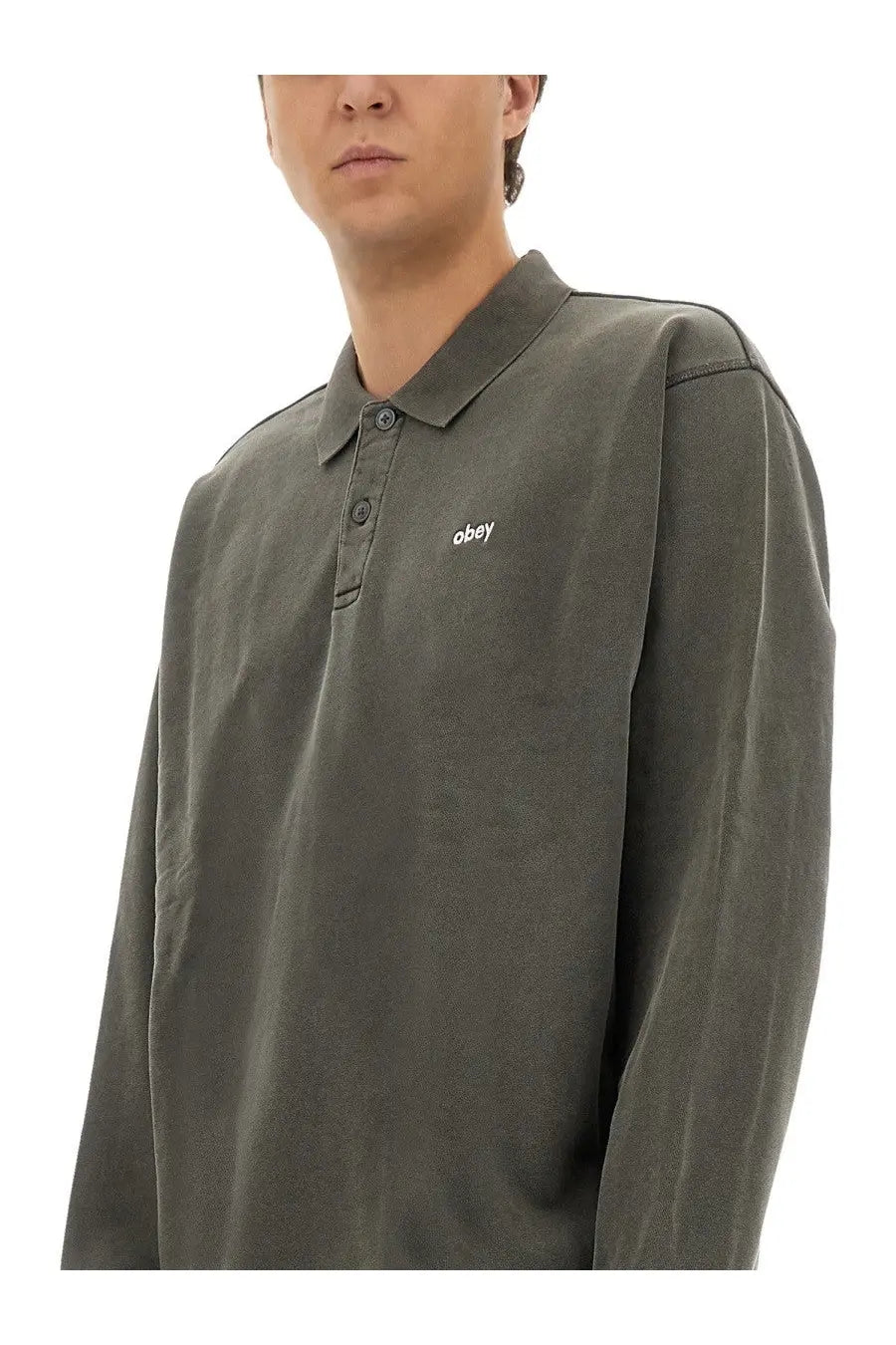 Obey men’s cotton polo in olive green with long sleeves and subtle obey logo embroidered on the chest