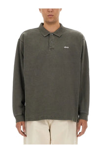 Obey men’s cotton olive green long-sleeved polo shirt with subtle obey logo embroidered on the left chest