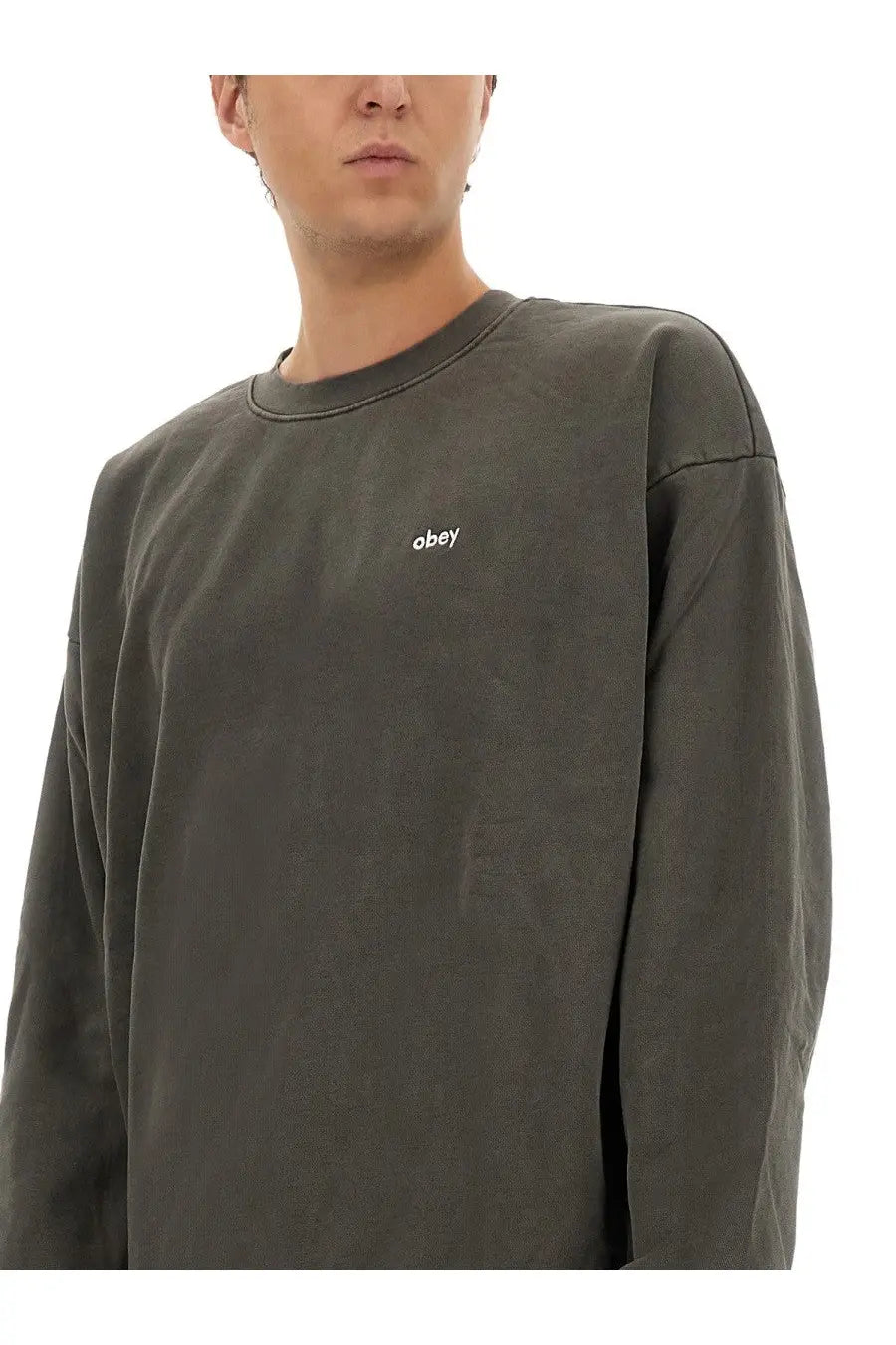 Obey men’s cotton sweatshirt black in dark olive green with long sleeves and small white obey logo on the left chest